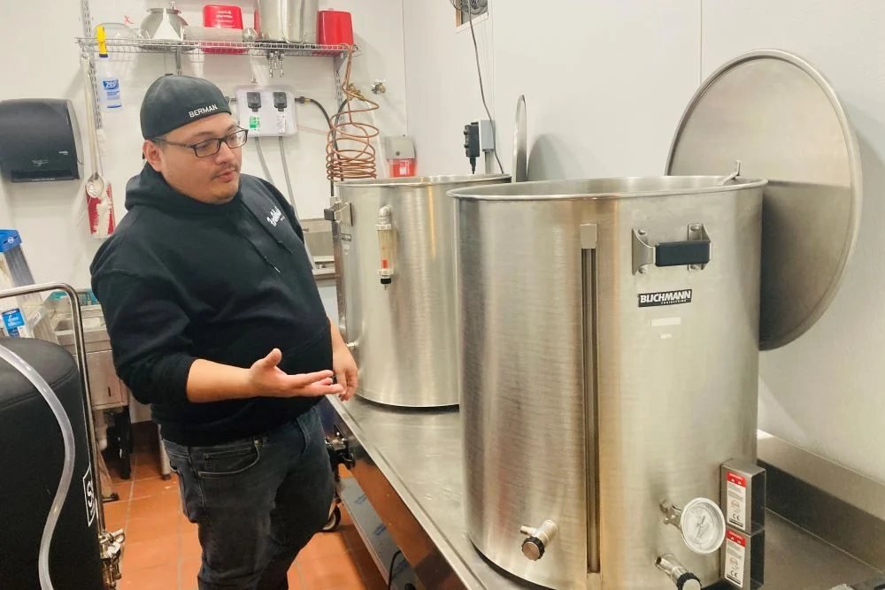 Firewhistle brewer at the brew kettles